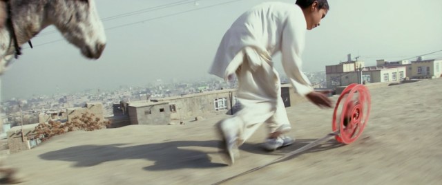 Francis Alÿs (In collaboration with Julien Devaux and Ajmal Maiwandi) REEL-UNREEL, 2011.  Single channel video projection; color, sound; 19:28 minutes. Courtesy David Zwirner, New York/London.