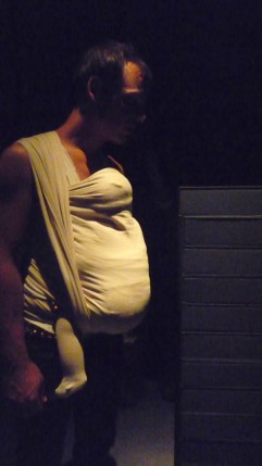 A visitor to the Berlinischer Galerie views Alfredo Jaar's installation of Real Pictures (1995). Photo by the author.