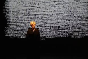 Caroline Bergvall, performance lecture, 2013. Photo by Helena Wikström.